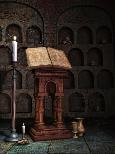 有一本书和蜡烛的墓穴 — 图库照片