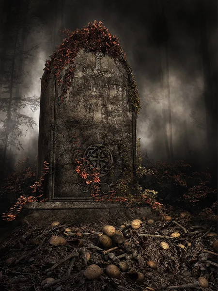 Tombstone on a pile of skulls — Stock Photo, Image