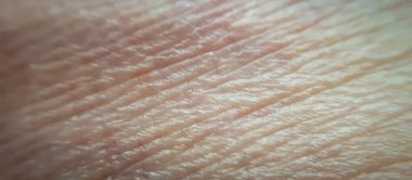 Süper makro insan derisi. Beyaz, sağlıklı, doğal ten. Dermatoloji tasarımı için arka plan olarak cilt