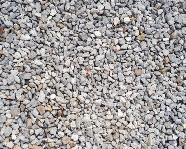 Çakıl dokusu. Çakıl taşı arka planı. Açık gri küçük kayalar. Üst görünüm