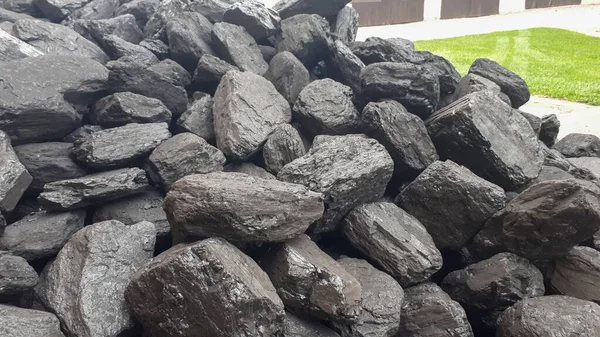 Pile Of Black Coal. Fuel and energy for home and industry. hard coal is harmful, high exhaust emissions. Mining and mining of coal