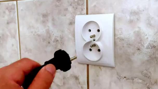 Man Hand Puts Wall Plug Socket Hand Plug Electricity Socket — Stock Video