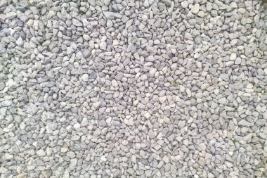 Gri çakıl desenli. Küçük kayalar yakın plan. Ezilmiş taş yüzey arkaplanı