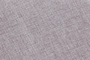 Tarafsız kumaş dokusu tasarım projeleri için mükemmel bir arka plan. Ev dekoru ve tekstil uygulamaları için yumuşak pembemsi bir renk..