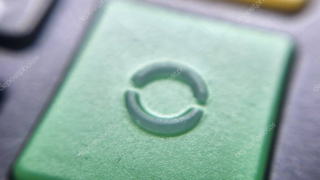 A close-up of a green button featuring a circular refresh symbol suggesting the concept of restarting or reloading. Ideal for technology interfaces or digital communications.
