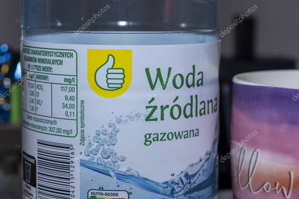 Warsaw Poland - October 18 2025: A bottle of sparkling spring water with clear branding and nutritional information displayed showcasing a refreshing beverage option.