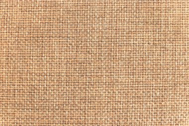 Moda el sanatları ve iç dekorda kullanıma uygun doğal toprak tonlarını veya tasarım uygulamalarını gösteren dokuma dokusu dokusunun yakın plan görüntüsü.