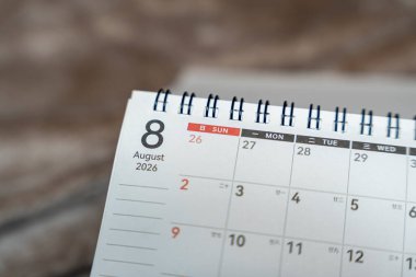 A close-up view of a calendar page displaying the date August 8 2026. The calendar is partially opened showcasing a clear layout with days of the week marked distinctly.