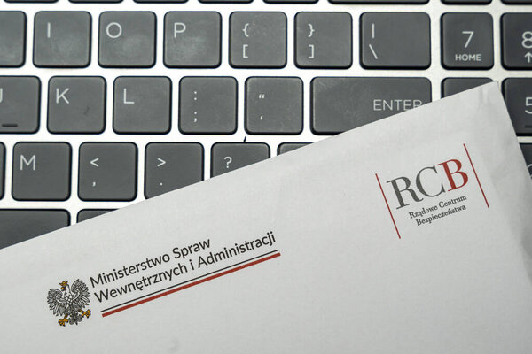 Warsaw Poland - Jan 29 2026: An envelope from the Polish Ministry of Interior and Administration alongside a laptop keyboard illustrating governmental communication.