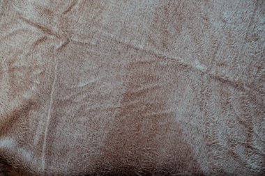 Nötr bej renkli yumuşak pelüş bir kumaş. Zarif iplikler içeriyor. Rahat bir atmosfer yaratıyor. Bu çok yönlü arkaplan ürün fotoğrafçılığı veya ev dekorasyonu için mükemmeldir..