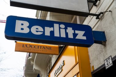 Vienna Austria- Feb 21 2026: Sign of Berlitz a global language education company displayed prominently in an urban setting adjacent to other retail signage indicating vibrancy.
