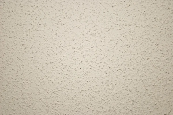 Fondo o textura de pared granulada beige — Foto de Stock