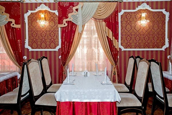 Cafe table in red interior — Stock Photo, Image