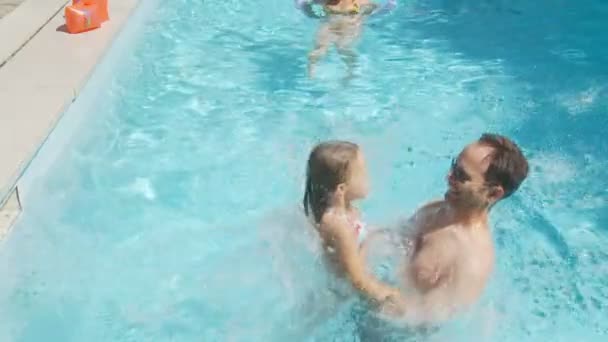 Daughter jumping into fathers arms — Stock Video