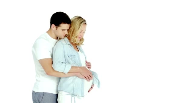 Pregnant woman with husband isolated on white — Stock Video