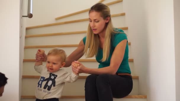 Baby boy crawling up steps — Stock Video