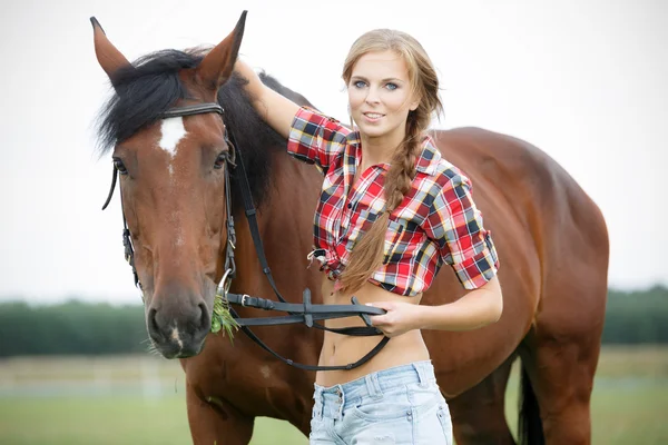 Beautiful smiling woman with horse chestnut — Stock Photo, Image