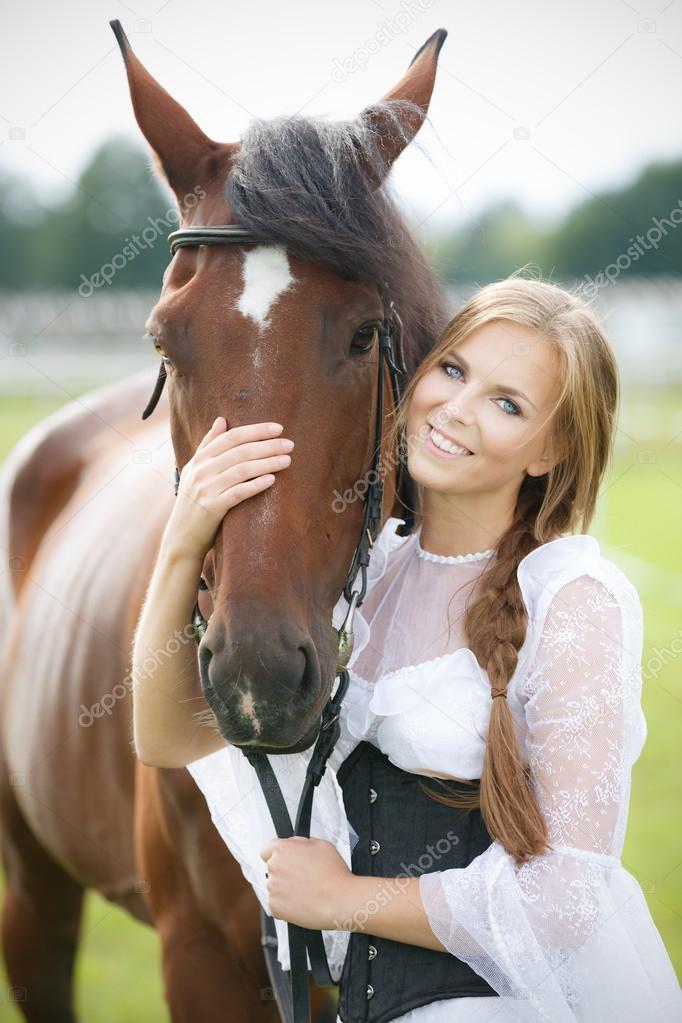 Beautiful smiling woman with horse chestnut