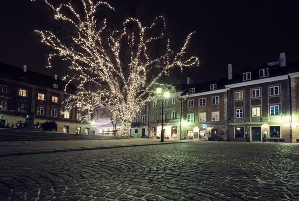 Christmas decorations on the old town of Warsaw at night — Stock Photo, Image