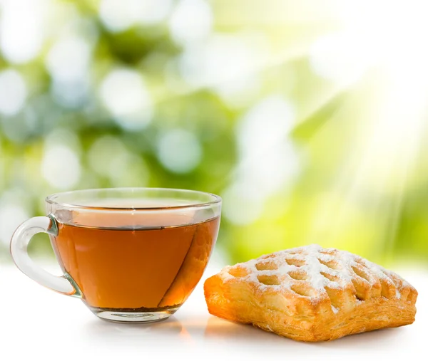 Isolated image of a cup of tea and cake close-up — Stock Photo, Image