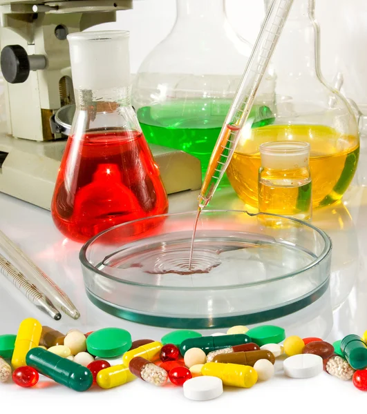 Varies glassware laboratory and pills Royalty Free Stock Images