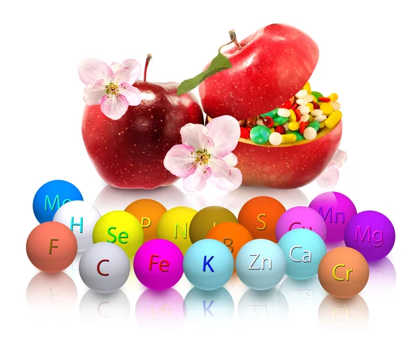 Isolated image of pills inside apples close-up — Stock Photo, Image