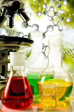 Laboratuar kapkacakları ve Dna strand arka plan yakın çekim üzerinde mikroskobu görüntüsü