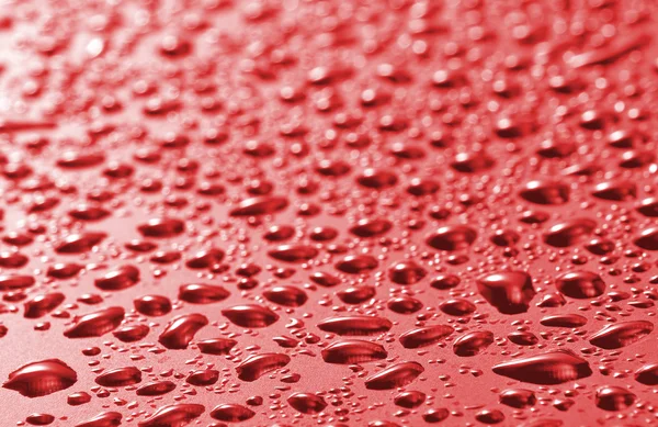 Imagen de la superficie roja con gotas de primer plano — Foto de Stock