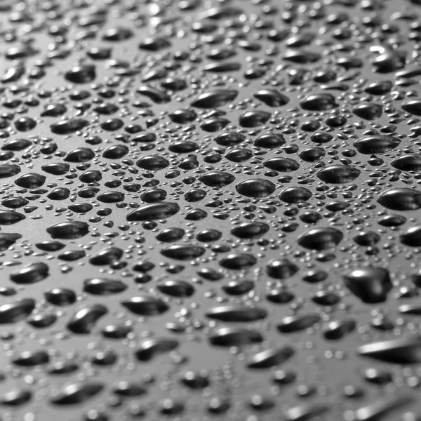 Imagen de una superficie gris con gotas de primer plano — Foto de Stock