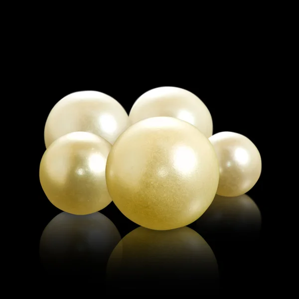 Image of pearls on a black background closeup — Stock Photo, Image