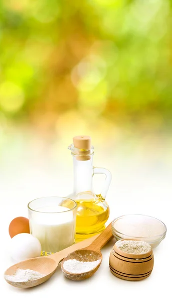 image of different ingredients for biscuits on a white background