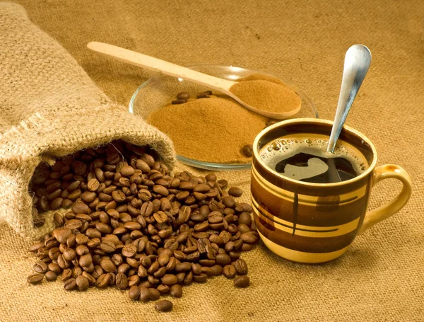 Ground coffee, beans and a cup of — Stock Photo, Image