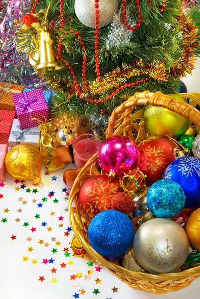 Different Christmas decorations in basket — Zdjęcie stockowe