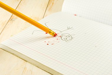 Pencil with eraser on exercise book  background clipart