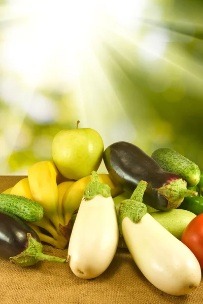 Different vegetables on the table on green background — Stock Photo, Image