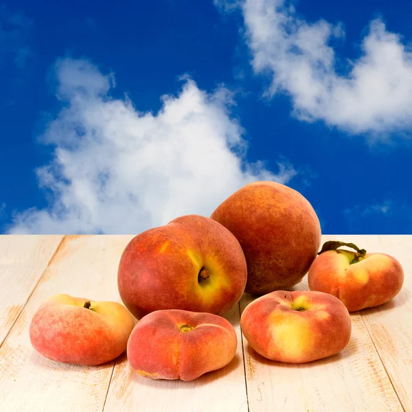 Peach on blue sky background — Stock Photo, Image