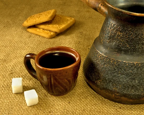 Cup of coffee, cezve and cookies — Stock Photo, Image