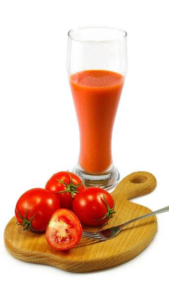 Pomodori e un bicchiere di succo — Foto Stock