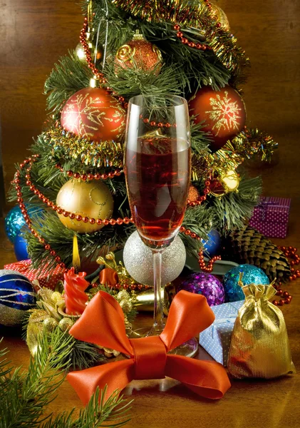 Christmas tree, candle and glass of wine Royalty Free Stock Photos