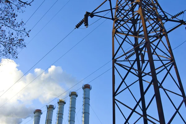 Unhealthy smoke from the chimneys against the blue sky — Stock Photo, Image