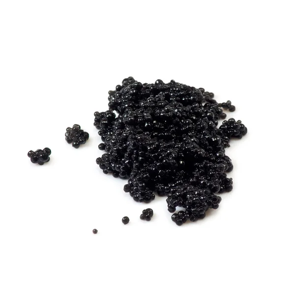 Svart kaviar på en vit bakgrund — Stockfoto