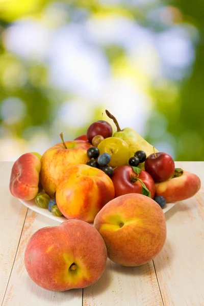 Different fruits on a plate — Stock Photo, Image