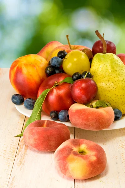 Different fruits on a plate — Stock Photo, Image