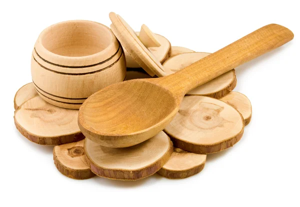 Cuchara de madera y un tazón en una tabla — Foto de Stock