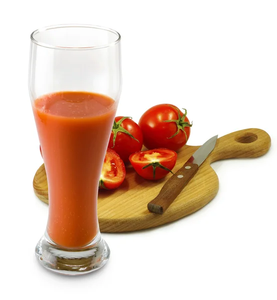 Изображение помидоров и стакан сока — стоковое фото
