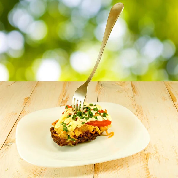 Cutlets with a fork on a plate closeup — Stock Photo, Image