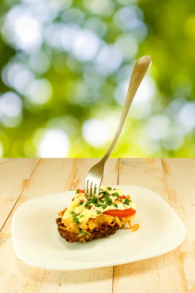 Cutlets with a fork on a plate — Stock Photo, Image