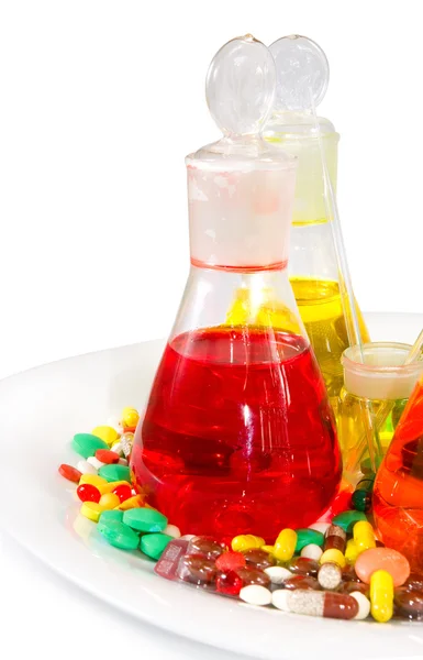 Frascos com líquido colorido e comprimidos — Fotografia de Stock