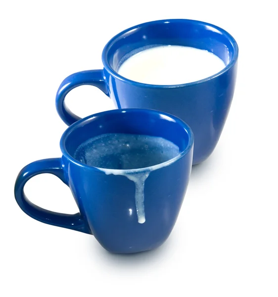 Empty cup and a cup of milk — Stock Photo, Image