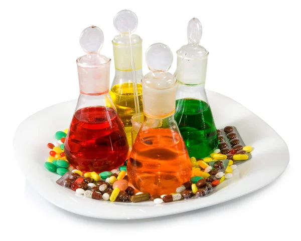 Imagem de frascos com líquido colorido e comprimidos — Fotografia de Stock